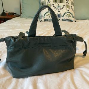 The Piazza Mini Crossbody Bag in the color Dark Palm!